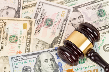 Judge wooden gavel with dollar money banknote concept for bribery