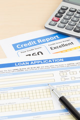 Obraz premium Loan application form excellent credit score with calculator, and pen
