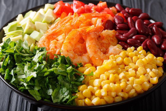 Burrito bowl with shrimp and vegetables close-up. horizontal