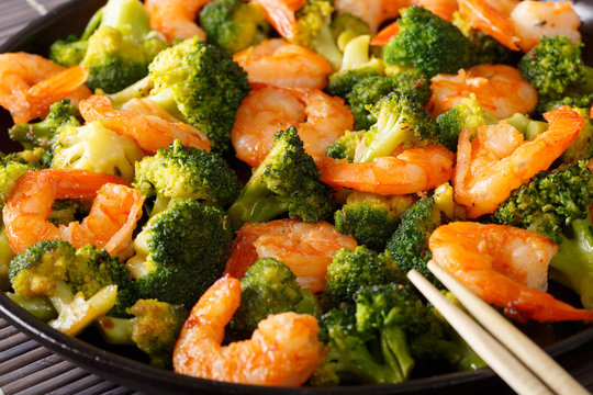 stir fry shrimp with broccoli and garlic macro. horizontal