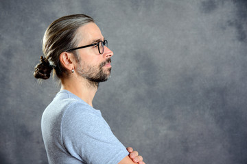 long haired young man with bun