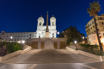 Fototapeta na wymiar Rome, Italy - The Piazza di Spagna square at the dawn in blue hour, with Trinità dei Monti stairs and Fontana della Barcaccia fountain