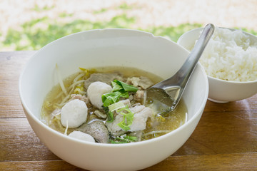 Thailand traditional ekaehla beef soup and cooked rice on the woodden table. Food thai style.
