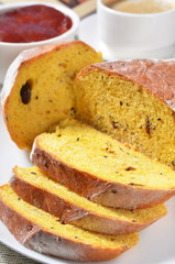 Slice of homemade pumpkin bread with a cup of coffee.