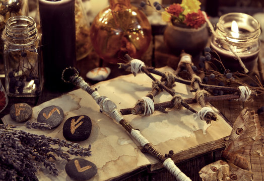 Magic wand, pentagram, lavender bunch, moth and runes, toned image
