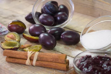 Foto op Plexiglas Fresh organic plums. Ingredients for preparation of jam. Bowl with jam. Close up © zoka74