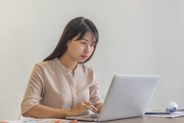 Young employee working on laptop
