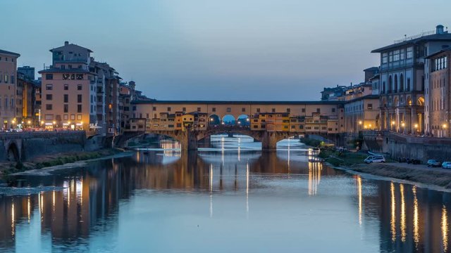 River Arno and famous bridge Ponte Vecchio day to night timelapse after sunset from Ponte alle Grazie in Florence, Tuscany, Italy