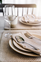 dining set with dish and spoon on white clean napkin