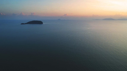 Aerial view. A tiny island viewed during sunrise.