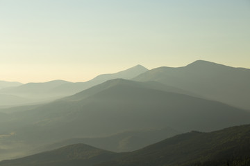 Sunrise against the background of the Carpathian mountains in the summer. Ukraine
