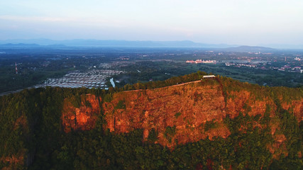 Aerial view. Beautiful colors reflected to the cliff during sunrise.
