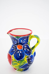 a close up of a flower print ceramic serving jug 