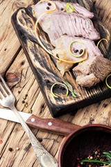 schnitzel on kitchen cutting board