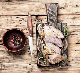 schnitzel on kitchen cutting board
