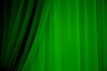 Green fabric background.