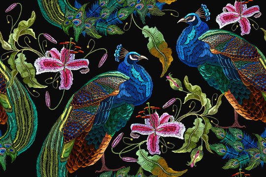 Embroidery peacocks and orchid exotic tropical flowers. seamless pattern. Classical fashionable embroidery beautiful peacocks. Fashionable template for design of clothes. Tails of peacocks and orchid