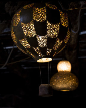 handmade pumpkin lamps, drilled with various measures to create drawings and light games, made by a craftsman of Belvì, Sardinia