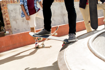 Fototapeta premium Teenage boy skateboarding outdoors