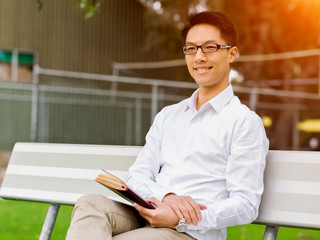 Young businessman during his break in park