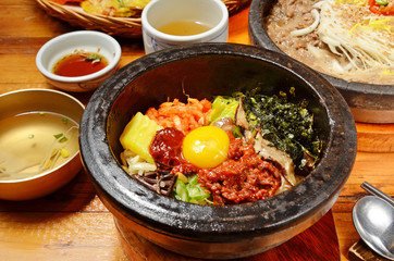 Korean beef bibimbap in hot stone bowl.    