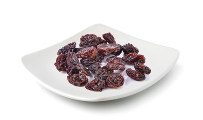 Dried raisins in a plate isolated on white background