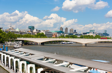River Thames, London, England, riverside Embankment Pier and Waterloo Bridge