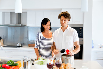 Couple cooking together at home