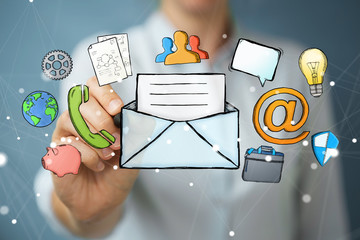 Businesswoman drawing manuscript contact icon with a pen