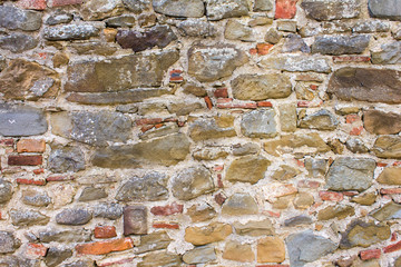 Medieval wall made with colorful rocks