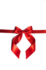 Red gift bow on white
