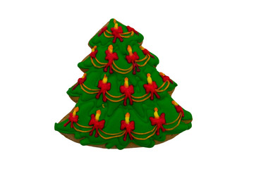Christmas gingerbread cookie made in shape of Christmas tree isolated on white background