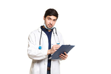 beautiful young doctor in a dressing gown with a stethoscope on a white background in the studio,with the ass, records a medical history