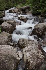 Nature in High Tatras in Slovakia. Mountains of rocky rocks cliffs and waterfalls suitable as background pictures of wishes, banners.