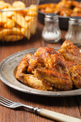 Baked wings, served with dip or baked potatoes.