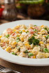 Traditional salad with cooked vegetables with mayonnaise.