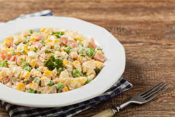 Traditional salad with cooked vegetables with mayonnaise.