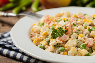 Traditional salad with cooked vegetables with mayonnaise.