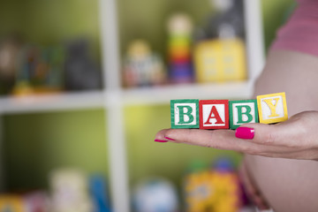 Obraz na płótnie Canvas Wooden toy cubes with letters, Baby, Pregnancy concept