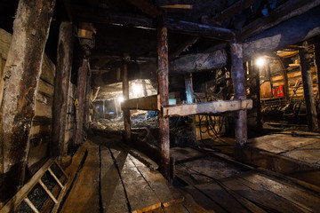 Underground emerald ore mine shaft tunnel gallery passage with light