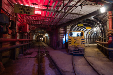Underground abandoned ore mine shaft tunnel gallery and electrical locomotive
