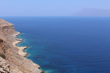 Fototapeta na wymiar Blue Mediterranean Sea and Rodopos peninsula, taken from the Balos peninsula, near Kissamos in Chania prefecture, Crete Island, Greece.