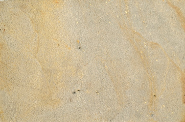 Light yellow smooth stone surface as a background