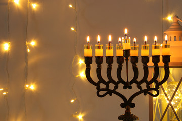 Low key image of jewish holiday Hanukkah background with menorah (traditional candelabra)