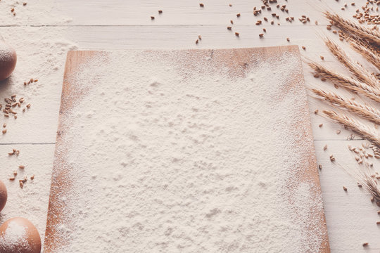 Sprinkled flour background with copy space