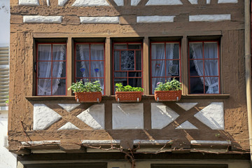 Fototapeta na wymiar traditional half-timbered window balcony at old medieval town, Switzerland.