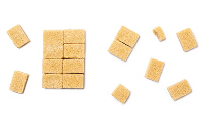 Brown cane sugar cubes isolated on white background, top view