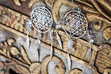 beautiful earrings on vintage background