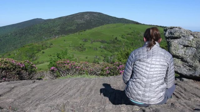 4k Slide Left Medium Behind Woman on Jane Bald Rocks