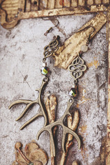 beautiful earrings on vintage background